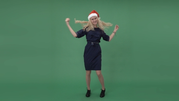 Woman In a Santa's Cap Dancing And Hanging Out