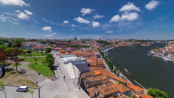 View Of The Historic City Of Porto, Portugal With Park . A Metro Train Can Be Seen On The Bridge