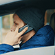 Businessman Talking on His Cell Phone While Drives the Car in the City - VideoHive Item for Sale