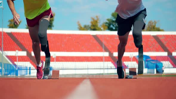 Men with Prosthetic Legs Start Jogging in Slow Motion