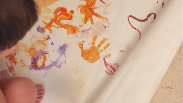 Little Boys Painting with Their Palms on Paper