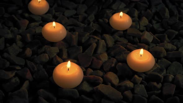 Passing Candles On Rocks At Spa