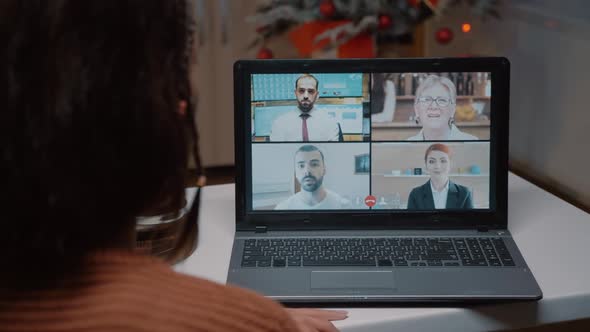 Young Adult Talking on Video Call with Friends at Home