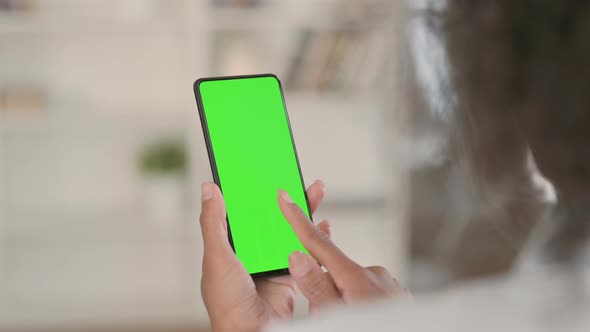 African Woman Using Smartphone with Green Chroma Key Screen