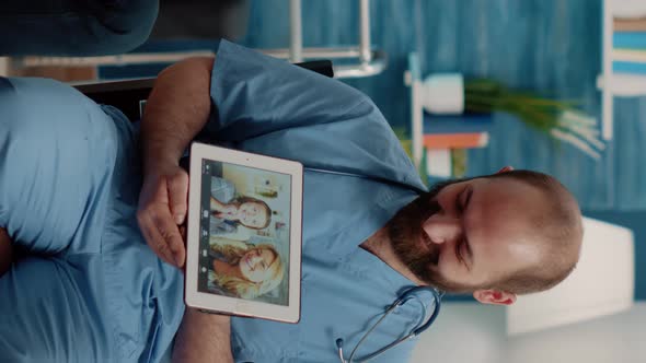 Vertical Video Disabled Man Talking on Video Call to Family in Nursing Home