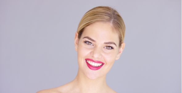 Laughing Young Woman Wearing Red Lipstick