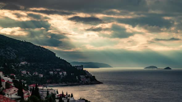 Timelapse of Sun Rays Beaming Through Clouds Over The Sea