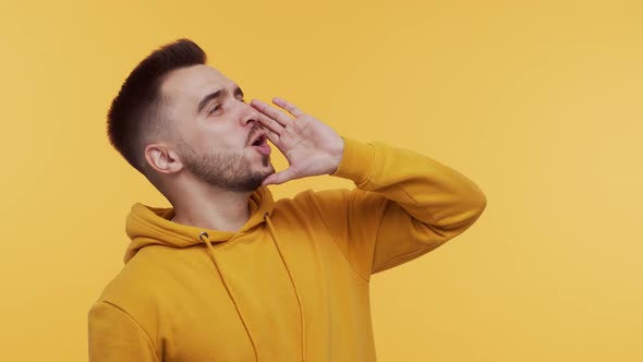 Expressive young man screaming and shouting over vibrant background.