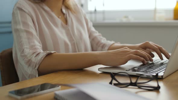 Woman Working With Laptop Computer At Agency Office