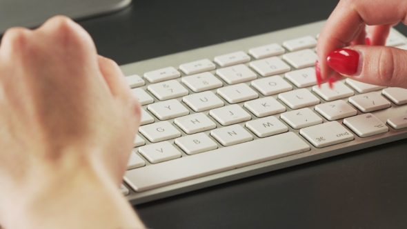 Woman Typing on a Keyboard and Making Gestures