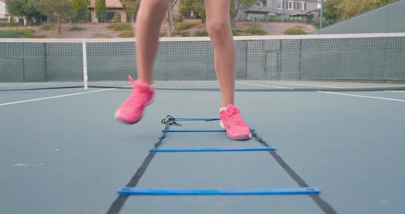 Close Up View of Female Legs Training on the Tennis Court