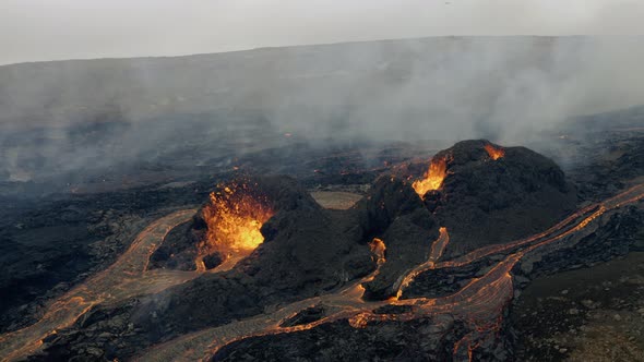 Two Lava Craters spewing Lava and Smoke in Iceland