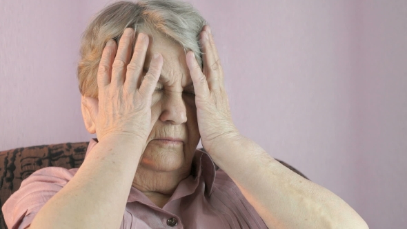 Woman Sitting Indoors Covers Face Her Hands