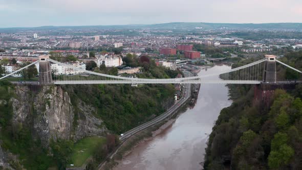 Dolly back drone shot of the clifton suspension bridge with central Bristol in the background