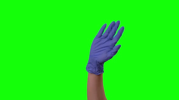 Doctor's Female Hand in Blue Glove Is Waving Welcoming You and Gesturing Come Here at Green Screen