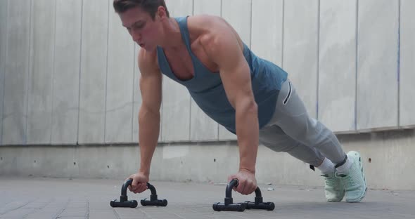 Young Man Athlete Doing Push Ups Outdoors