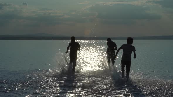 Happy Kids Running On The Salt Lake Slow Motion 2