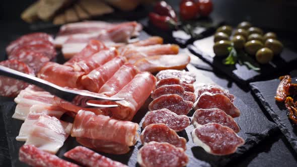 Salami and Chorizo Sausage Close Up on Stone Serving Board