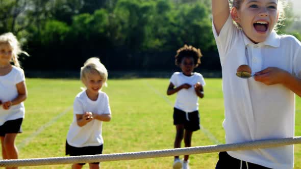 Children playing lemon and spoon race