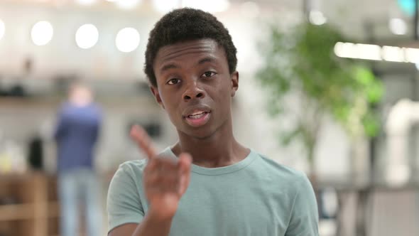 No, Young African Man Waving Finger To Reject