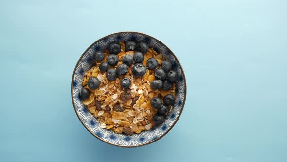 Cereal Breakfast and Blue Berry in Bowl on Table