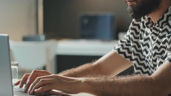 Middle Eastern Man Using Laptop