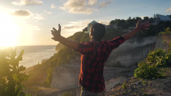 Silhouette of a Man Praying at Sunset Concept of Religion alt