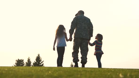 Back View Soldier in Uniform Walk with Daughters.