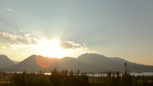 Sunset time lapse of lake and mountains alt