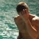 Young Bare-chested Man Is Swimming in Pool. Guy Is Taking His Hand To Head and Playing with Hair. Is - VideoHive Item for Sale