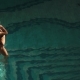 Young Sexy Woman in the Pool Playing with Her Hair, Looking at the Sunset - VideoHive Item for Sale