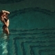Sexy Woman in European Hotels Pool Playing with Her Hair, Dancing, Looking at the Sunset/sunrise - VideoHive Item for Sale