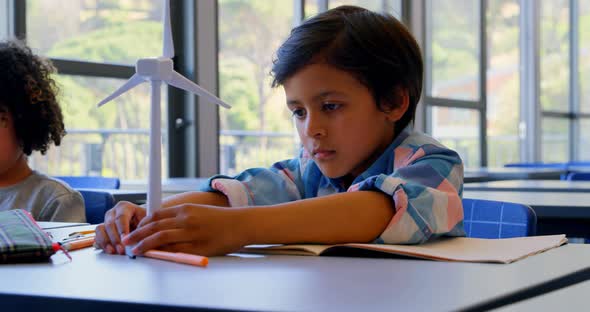 Schoolkids studying at desk in the classroom at school 4k