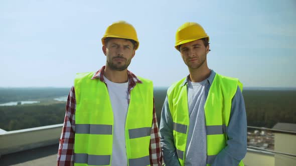 Workmen Looking Camera Standing Rooftop Outdoors, Construction Industry, Job