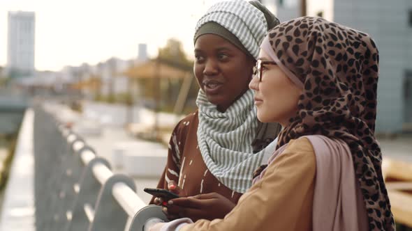 Female Friends Talking Outdoors