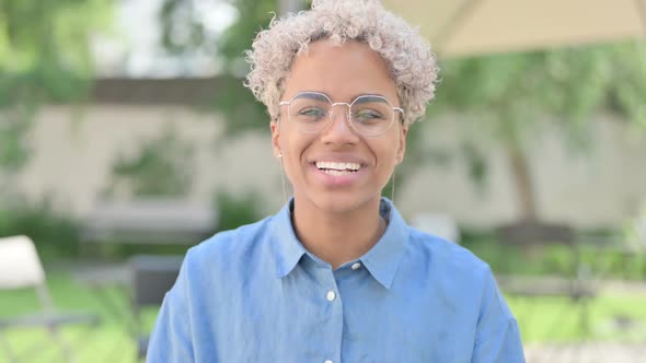 Portrait of Young African Woman Talking on Online Video Chat