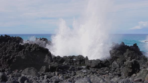 Waves crashing into shore on Hawaii