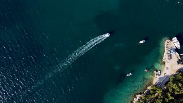 Aerial view of a motorboat sailing near Primosten, Croatia.