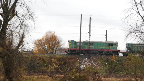 Old Train Transports Cargo. Freight Train Is Moving From Right To Left.