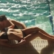 Young Couple Swimming in the Pool in Luxury Hotel - VideoHive Item for Sale