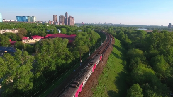 Moving Suburban Electric Train on the Bridge Near the Junction