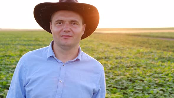 Portrait of a Farmer in a Blue Shirt Talking About Agribusiness on Camera