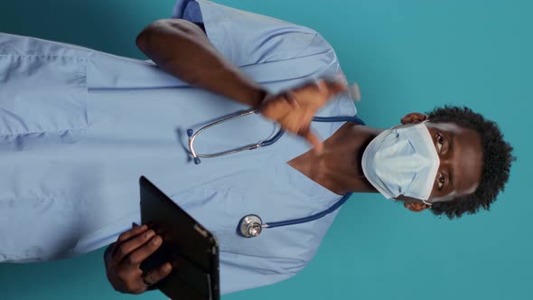 Man Nurse with Face Mask Explaining Coronavirus Epidemic