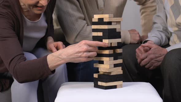 Aged Friends Group Playing Table Game, Having Fun Together, Active Retirement