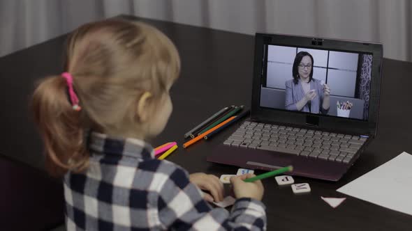 Girl Distance Education Lesson with Woman Teacher, Using Digital Laptop at Home