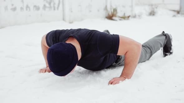 Athlete Doing Push Ups on the Snow, Crossfit Exercise