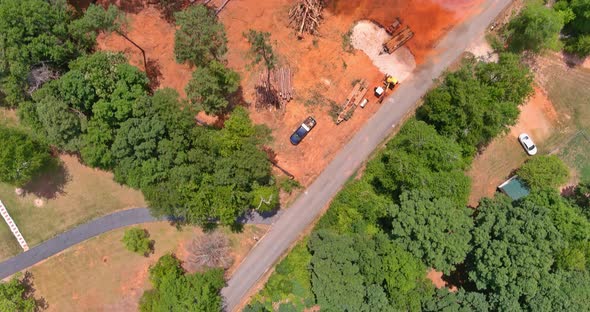 Clearing Land From Roots for a Subdivision Using Tractors Skid Steers Uprooted and Burning the