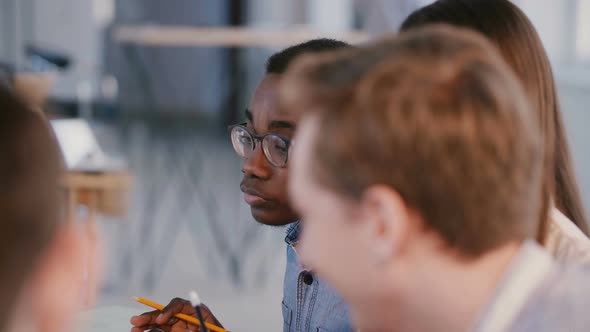 Multiethnic Young Professionals, Business Partners at Team Meeting, Focused African American Male