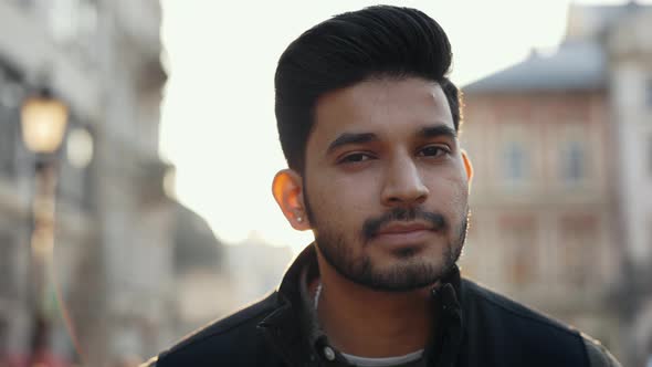 Indian Guy Standing Outdoors and Smiling on Camera