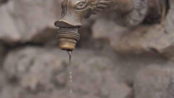 Faucet with Falls Water Drops. Water Consumption and Shortage Concept
